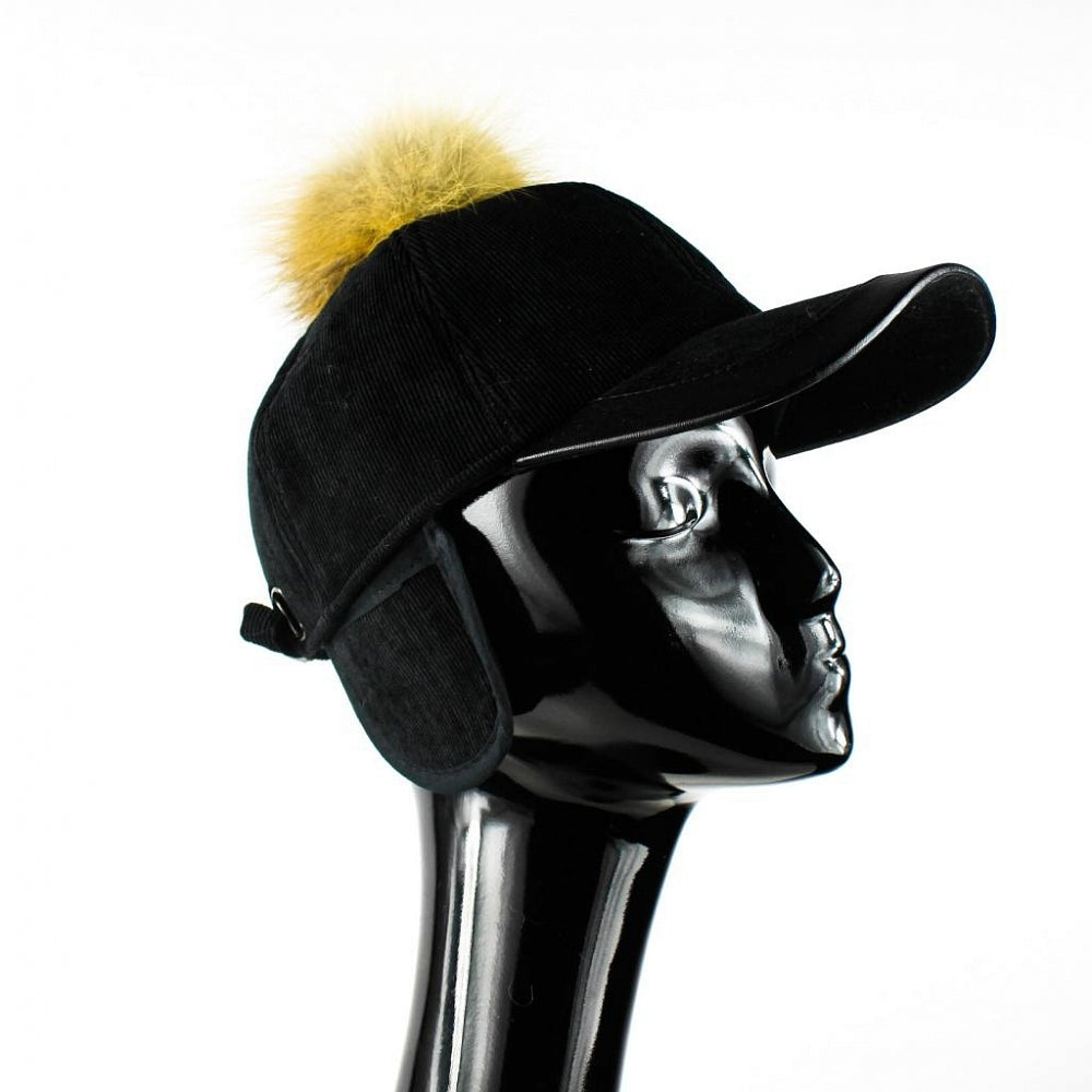 Black hat with peak and natural fur pom pom