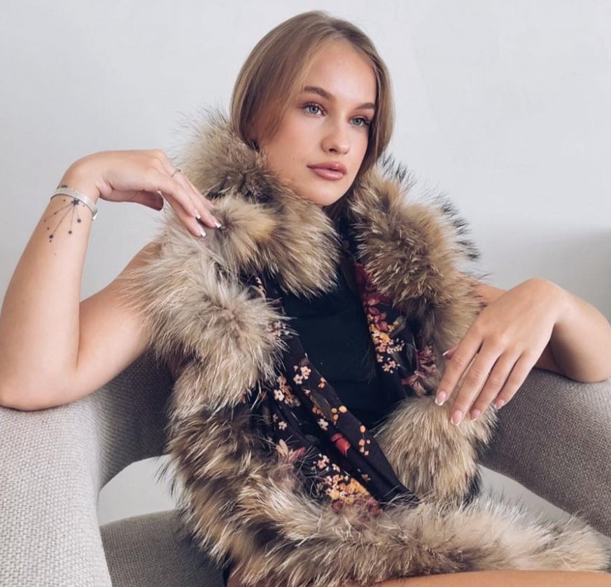A beautiful scarf with floral patterns and natural fur accents