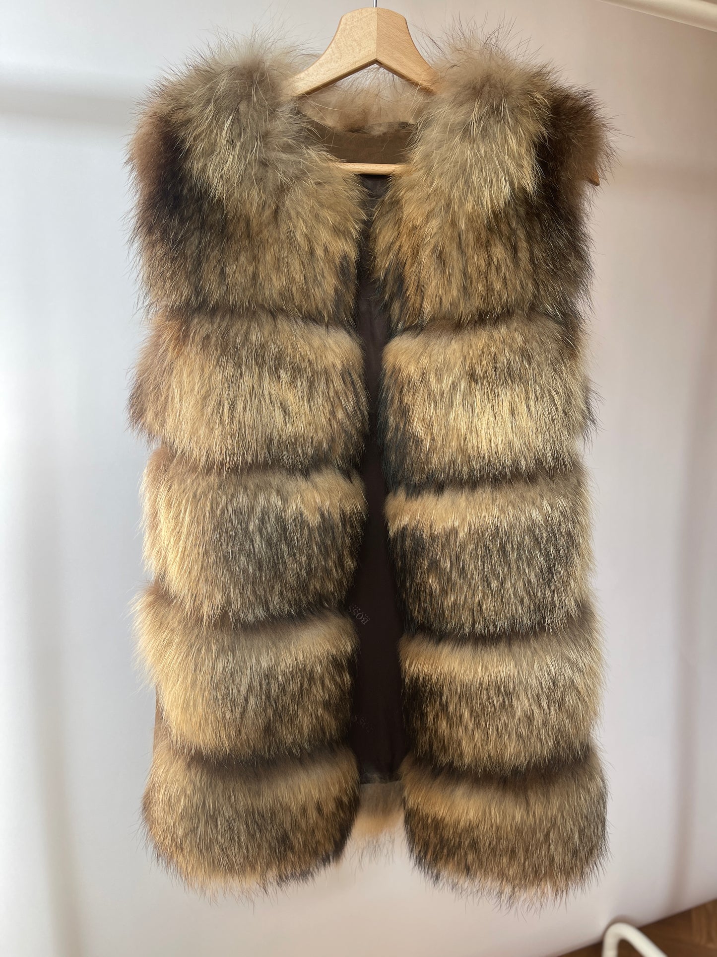 Stylish vintage - style natural fur vest with genuine leather inserts